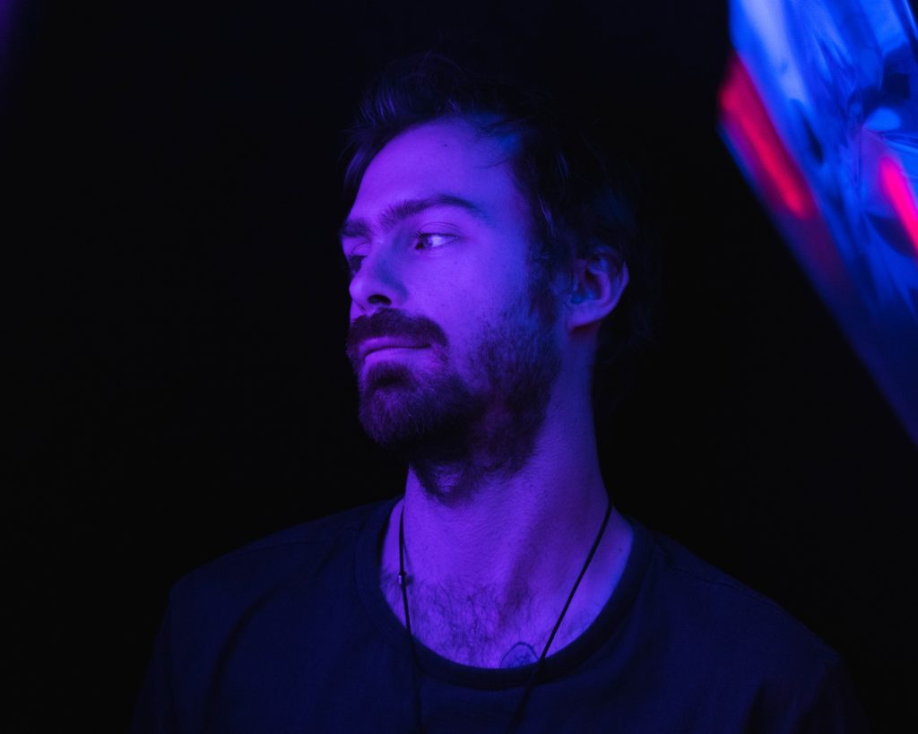 Zak Roams in purple lighting